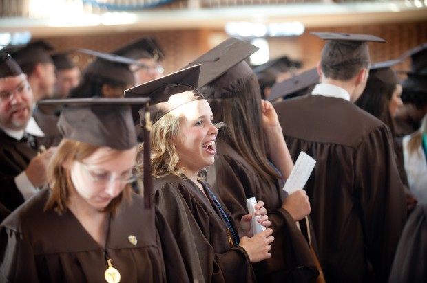 Valparaiso University student Cynthia Cunningham smiles as she stands with fellow education majors before their commencement. © The Times/Kyle Telechan