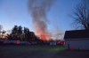 Fire departments work to put out brush fire