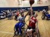 Wheelchair basketball players exhibit their skill for youngsters