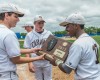 Mount Carmel players admire Class 4A Reavis Sectional plaque