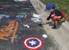 Kids paint the Crete Library parking lot