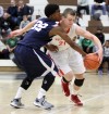 Crown Point's Thomas Bardeson drives around Michigan City's A'Seante Clark on Thursday night.