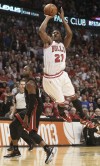 Bulls small forward Jimmy Butler shoots over Miami's Norris Cole during the second half of Game 3