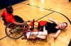 Wheelchair basketball players exhibit their skill for youngsters
