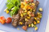 A grilled steak with bold flavor and cooling salsa