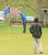 Highland's Nick Canham tries to sink a long putt on the No. 9 green Friday afternoon at the Uebele Invitational.