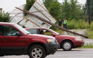 Storm tears off roofs, leaves thousands without power, uproots 100-year-old trees