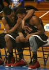 21st Century's Davis Jarnigan wipes a tear from teammate Dantrell Hurt's face