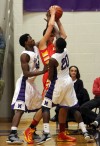Merrillville's Jelani Pruitt, left and B.J. Jenkins defend