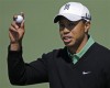 Poulter leads at Augusta but Woods in hot pursuit