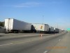 Crash involving four semis sends woman to hospital