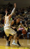 Purdue Calumet's Jaime Burkhard tries to find a way around Valparaiso's Bobby Capobianco
