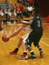 Hammond's Keirahn Richard guards Munster's Mike Schlotman