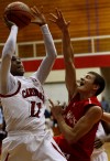 E.C. Central's Hyron Edwards shoots over Munster's Luke Wuchenich