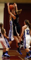 Lake Central's Jessica DelBovo defends against Lowell's Carley Austgen
