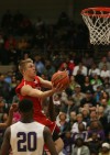Munster's Nate Bubash drives against Merrillville on Saturday.