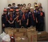 Scouts donate food and stock the shelves