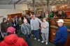 Auction participants bid on library contents, property