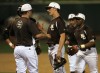 Mount Carmel pitcher Jeff Boehm talks with pitching coach Dan O'Brien