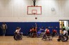 Wheelchair basketball players exhibit their skill for youngsters