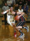 Munster's Craig Dedelow guards Lowell's Eric Zukauskas 