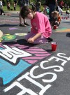 Kids paint the Crete Library parking lot