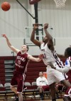 Indiana University Northwest's Adam White, left and Calumet College's Brannon Jones watch a loose ball
