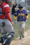 T.F. North's Levon Stone jogs into home