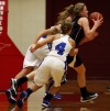 Lowell's Katlyn Bobos steals the ball and goes through Lake Central's Megan Krol