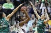 Texas A&M's Adaora Elonu, center, is double-teamed by Notre Dame forward Becca Bruszewski