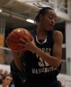 Washington's Victoria Bradley grabs a rebound