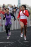 T.F. North runner Imani Cobbs attempts to pass 