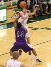 Valparaiso's Tyler Doane passes over Merrillville's Jalen Wilbert to fellow Viking John Mosser on Friday.