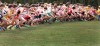 Dozens of boys leave the starting line of the New Prairie Semistate