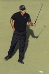 Woods shares lead with Furyk, Toms
