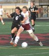 Portage's Kristen Ashby, left, locks up with Chesterton's Rosie Biehl 