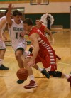Crown Point's Tom Bardeson tries to drive past Valparaiso's Brody Wilson