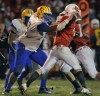 Crete Monee's Jonathan Schultz pressures Ottawa quarterback William Hoffman 