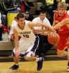 Merrillville's Jake Rapopovich, left, tries to control the ball while Andrean's Matt Ruberry defends