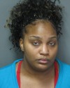 Woman charged after firing gun on Lansing street