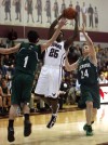 Bowman Academy's Austin Daniels shoots over the defense of LaCrosse's Bryan Shoupe and Ryan Pahl