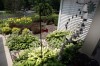 Windchimes highlight this shade garden