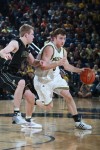 Michigan's Zack Novak is guarded by Purdue's Robbie Hummel.