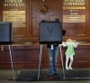 Officials report long lines, only minor problems for voters