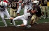 Davidson's Zach Clark tries to grab Valparaiso's Jake Hutson