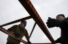 METAL PRICES, Matt Petropoulos, left, of Cedar Lake, and his father, Dave, of Griffith unload some steel shelving