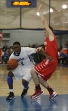 Lake Central's Tye Wilburn tries to get past Munster's Drew Hackett 