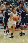 Merrillville junior guard Myranda Harris steals a pass intended for Michigan City sophomore guard Michal Miller on Saturday night.