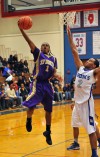 T.F. North's Deandre Lowery finishes off a fast break