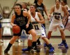 Lowell's Kalyne Godbolt, left, drives past Lake Central's Tara Zlotkowski